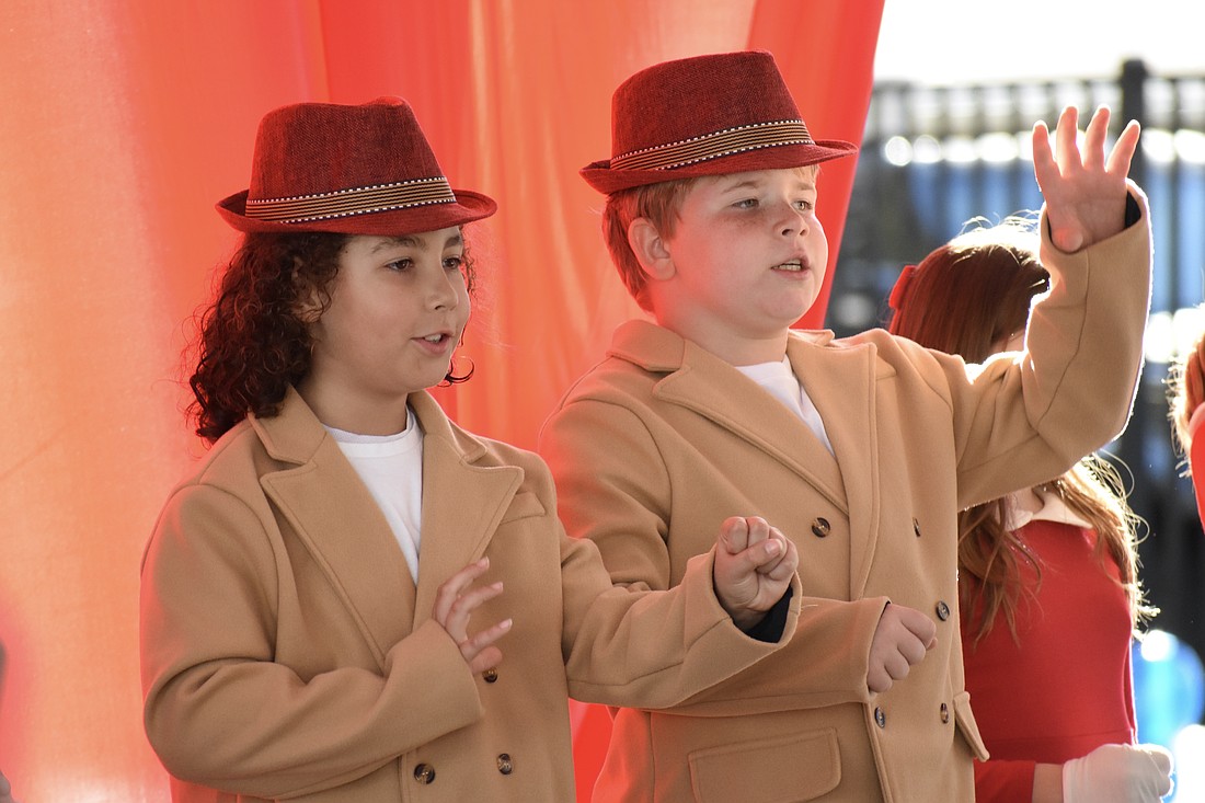 Third graders Silas Swor and Misha Reus perform in "Button Up Your Overcoat," celebrating the 1930s.