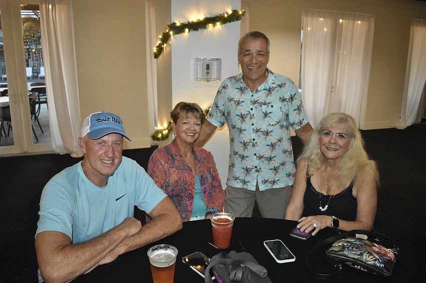 Chuck Campbell, Ann Atkins, Don LoBello and Karen Parker gather at a table.