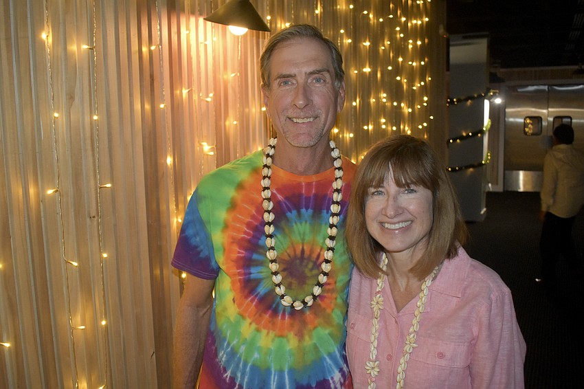 Bryan Swilley and Kimberly Frey brought a tropical vibe with their necklaces and attire.