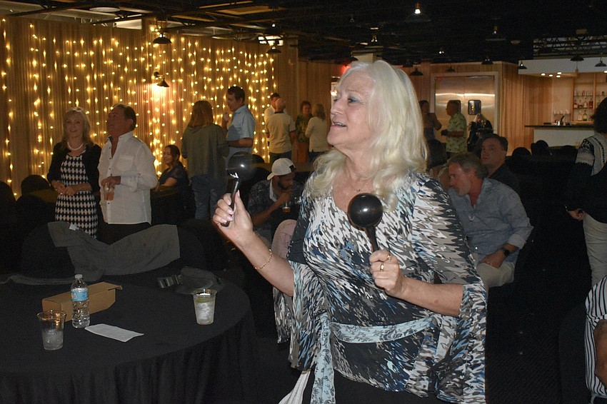 Terri Weichman makes sound with the maracas.