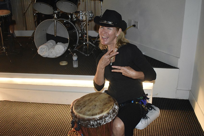 Vykky Contreras plays her drum at the event.