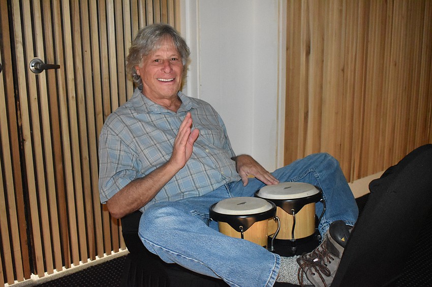 Alan Bitterman, a member of various local drum circles, plays at the event.