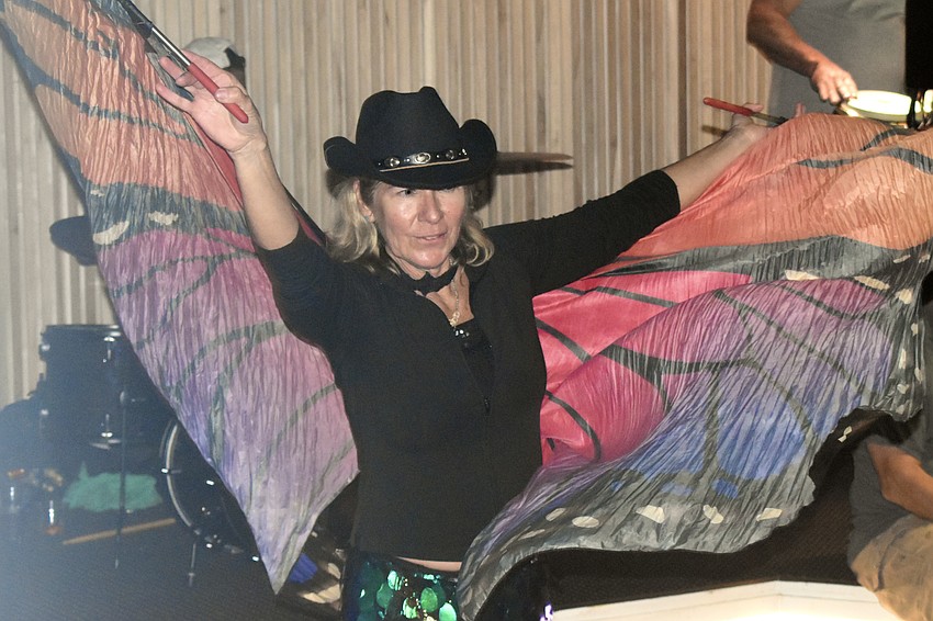 Vykky Contreras brought a pair of butterfly wings to the event that she uses at the Siesta Key Drum Circle.