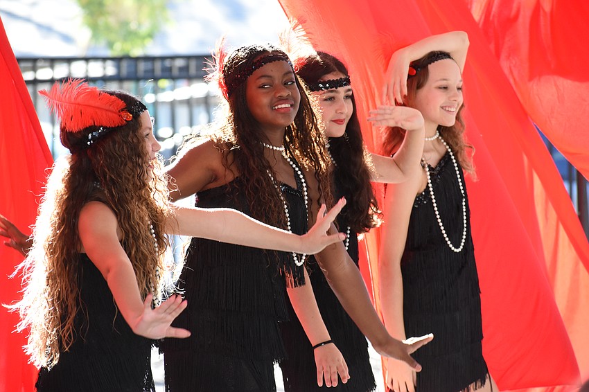 Fifth graders Eva Portnow-Rivas, Ma’laya Harris, Sienna Ackerman and Adrianna Scott perform the Charleston, celebrating the 1930s.