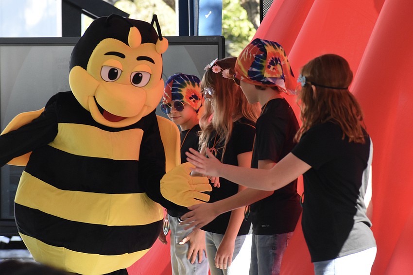 As students celebrate the 1960s, the school's former mascot, from the days of the Southside Stingers, makes an appearance.