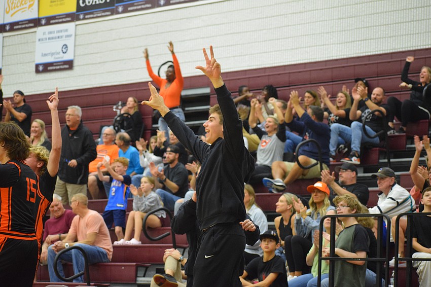 Johnny Lackaff throws up three fingers on both hands to celebrate a 3-pointer by the Sailors. He guided them to the 2025 FHSAA Class 7A state semifinals as a sophomore with 21.9 points per game.