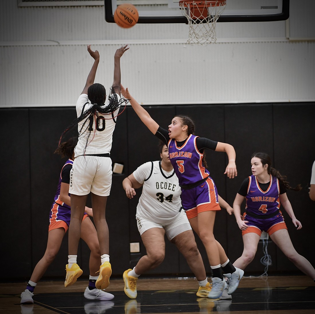 The Knights’ Gabriella Fortius jumped high to shoot above Horizon’s defense. Ocoee won the game 69-35.