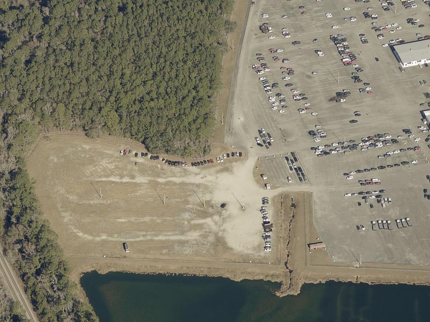 The parking expansion area Carvana is considering at 11700 New Kings Road.