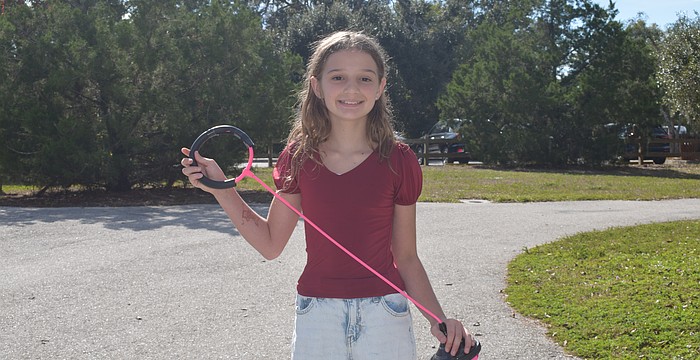 Kensington Kotuby has etched her name into the Kids World Records book for the longest time doing Skip-It jumps in the girls' 10-12 year old division.