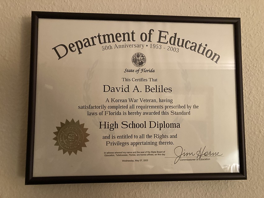 David Beliles proudly hung his high school diploma in his Plymouth Harbor apartment.
