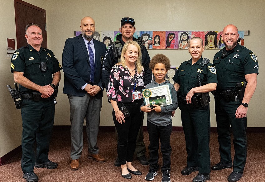 Rymfire Elementary School third grader Kingston Bass is presented with the FCSO's Great Kids Award for elementary level. Courtesy photo
