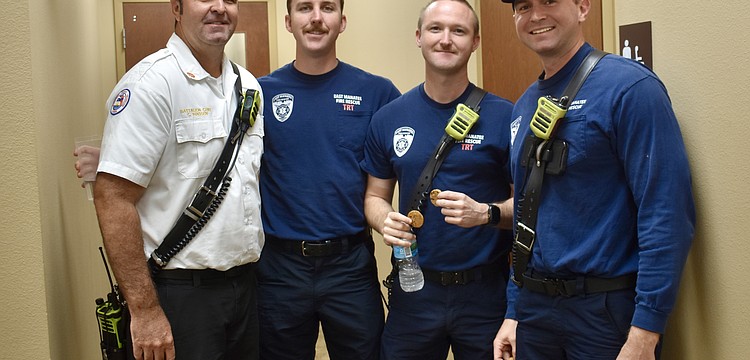 The crew from Station 1 walk across the parking lot to grab some lunch. From left to right: Battalion Chief Craig Madsen and firefighters Adam Stem, Evan Berggren and Tyler Schuele.