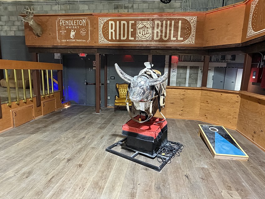 The bull riding area at Kicker’s Country Bar, also called Kicker’s Saloon. A cornhole board provides less dangerous entertainment.