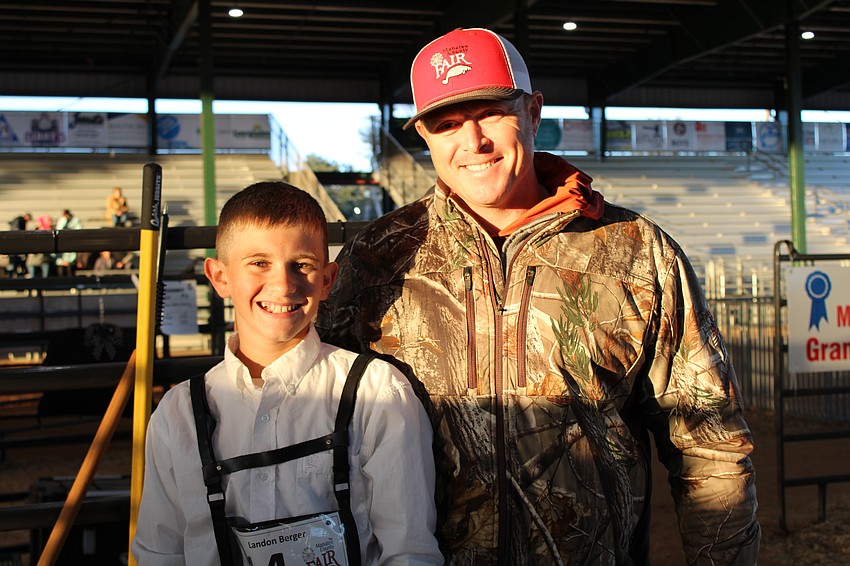 Myakka City's Landon Berger and his father Tyler Berger appreciate the learning curve that comes with showing an animal at the Manatee County Fair. Berger shows a Maine Angus named Sirloin, who weighs 1,120 pounds.