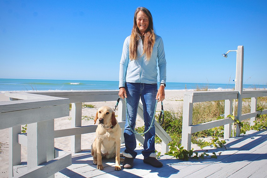 Sarah Frederick, pictured on a sunny afternoon at her Longboat Key home with her yellow lab, Lizzie, made a name for herself as part of the first wave of women to compete in high-level jockeying. She participated in horse races, jumping, dressage and fox hunting for 55 years.