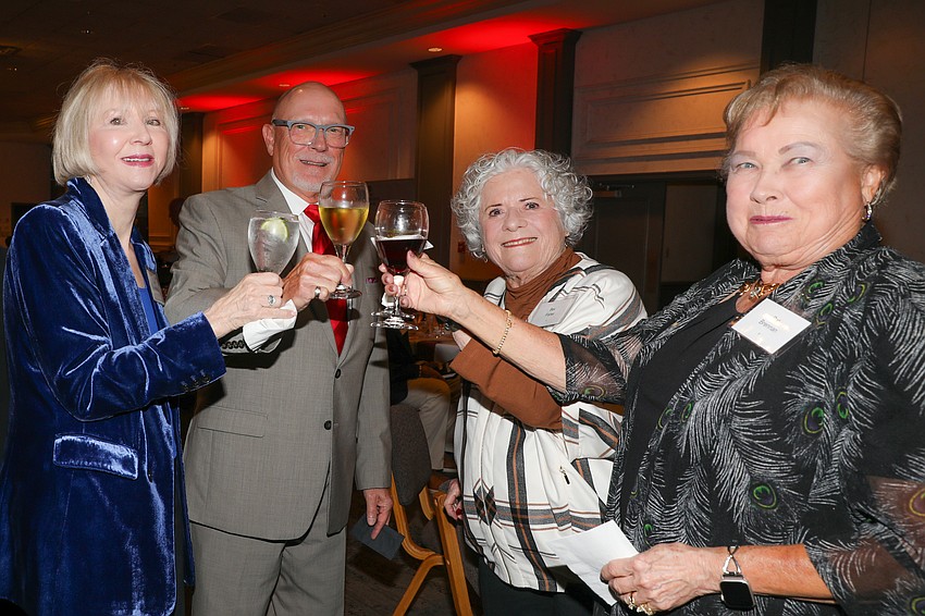 Jane Summerville, Mark Terman, Bev Fisher and Pat Brennan raise their glasses to the Sarasota Orchestra.