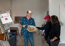 Couch LBK co-owner Ken Rushing shows a pair of shoppers a fabric sample inside the furniture showroom at Brista Commons Wednesday, Jan. 14.