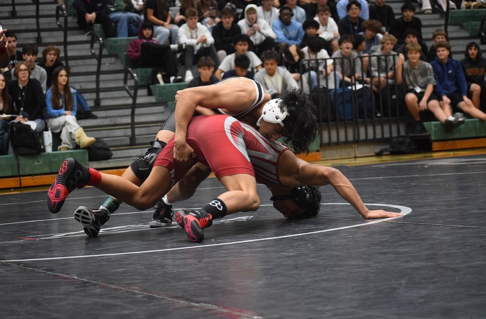 Lakewood Ranch junior Ricardo Rengifo wrestles Javier Puchi in the 138-pound weight class.