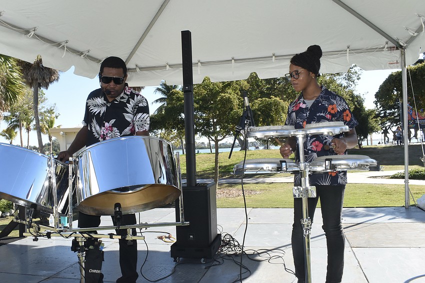 Ephraim Adams and Rissi Adams, 14, of Rhythm Trail, perform on stage.