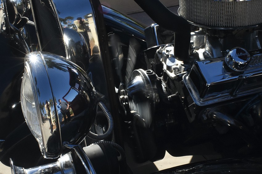 The motor spins on a 1930 Ford Coupe Hot Rod owned by Dan and Donna Hall.