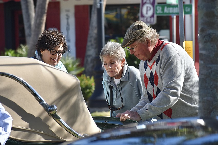 Brigitte Burke and Sheryl Taritas get a look at the 1939 MG VA owned by Douglas Kniff.