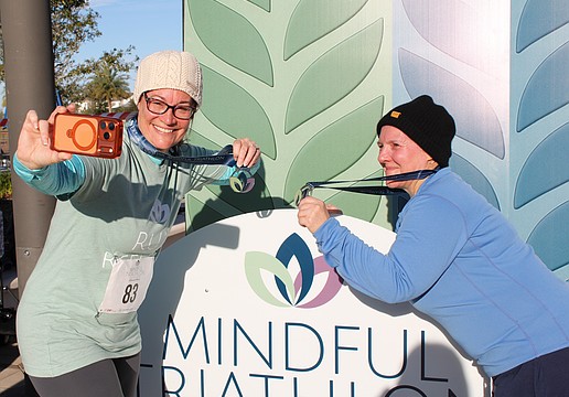 Lakewood Ranch's Rhonda Leiberick and Roscelyn Guenther snag a selfie together in between the running and yoga portions of the triathlon. They alternated between walking and running every two minutes.