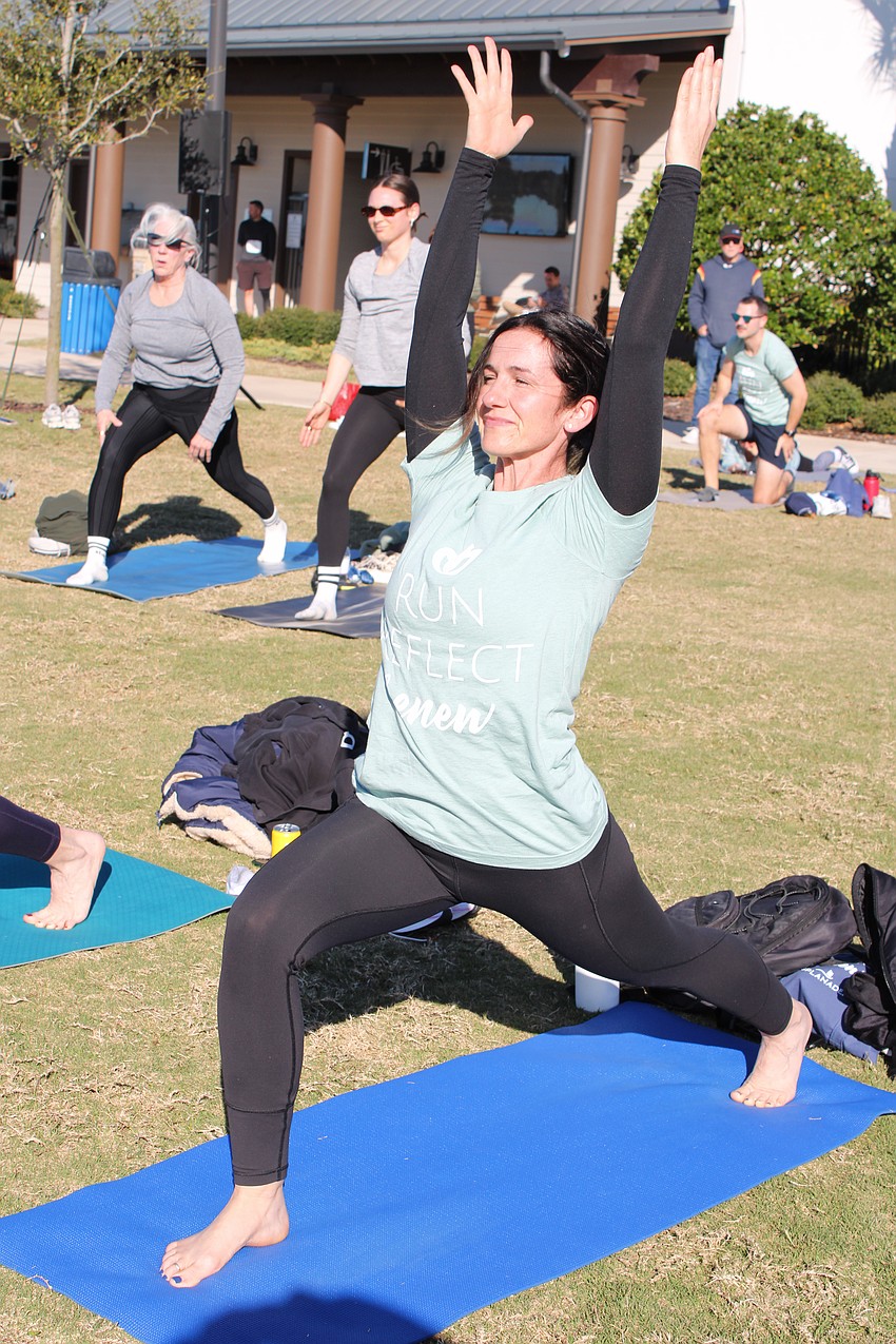 Bradenton's Stephanie Morton follows along during the yoga session after the 5k, which she completed in 47 minutes and 14 seconds.