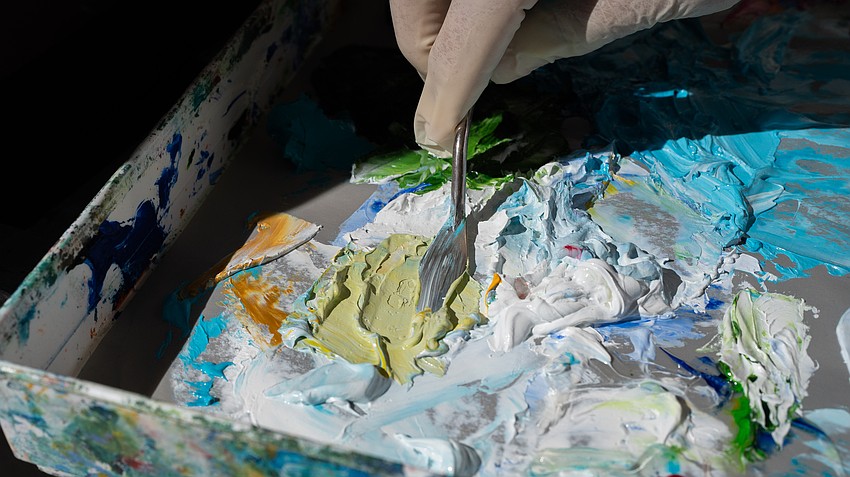Mixing oil paints with a pallet knife is a delicate process, a skill Pat Lundy learned and practiced at the Longboat Key Center for the Arts until the facility closed in 2017.