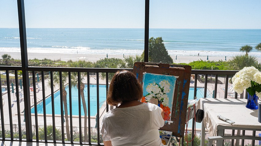 Artist Pat Lundy likes to sit on her lanai overlooking the Gulf when painting solo, but says she wishes there was a place on Longboat Key where artists could meet to paint together.