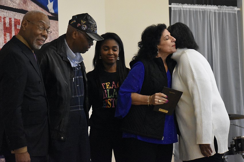 Sarasota MLK Celebration Committee chair Jetson Grimes; former mayor Willie Shaw; Mistress of Ceremonies Jessika Ward; Susan Imperato, the GED teacher and coordinator at the Newtown campus of Suncoast Technical College who was honored for her work in education; and commitee member Bel Feltner, gather on stage.