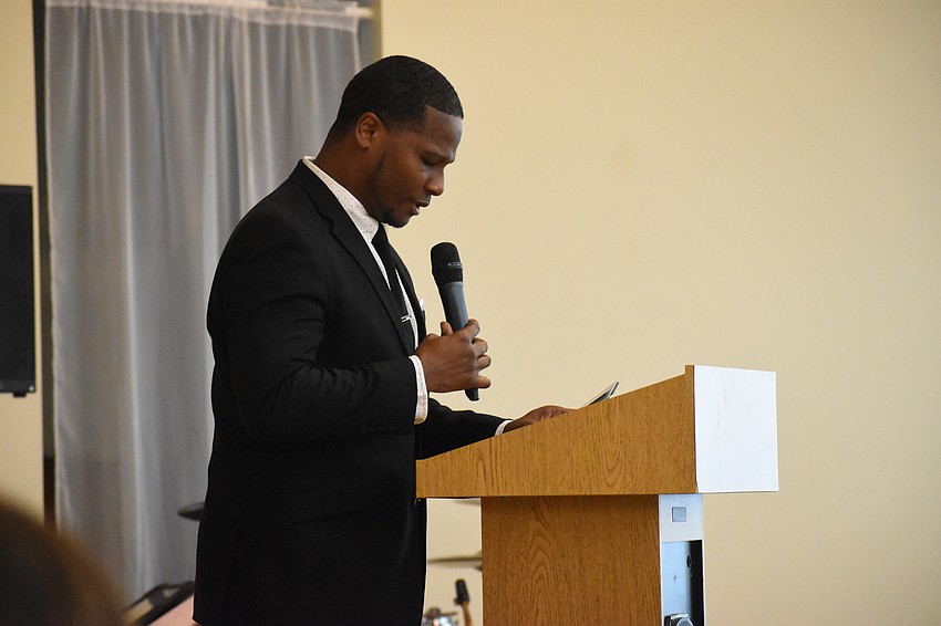 Minister Anthony Davis, Sr., of New Bethel M.B. Church, offers the benediction.