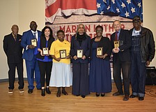 Sarasota MLK Celebration Committee Chair Jetson Grimes, awardees Joseph Mack, Susan Imperato, Valerie Buchand, Meadow Lark Walker, Monica Donley and David Morse, and former mayor Willie Shaw, gather on stage.