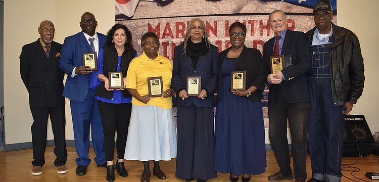 Sarasota MLK Celebration Committee Chair Jetson Grimes, awardees Joseph Mack, Susan Imperato, Valerie Buchand, Meadow Lark Walker, Monica Donley and David Morse, and former mayor Willie Shaw, gather on stage.