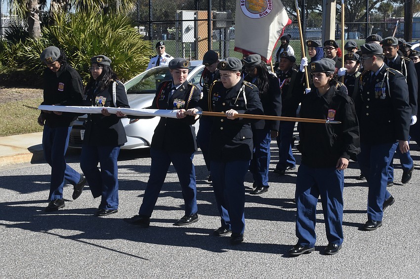 Students from Booker High School's JROTC program make their way along the parade route.