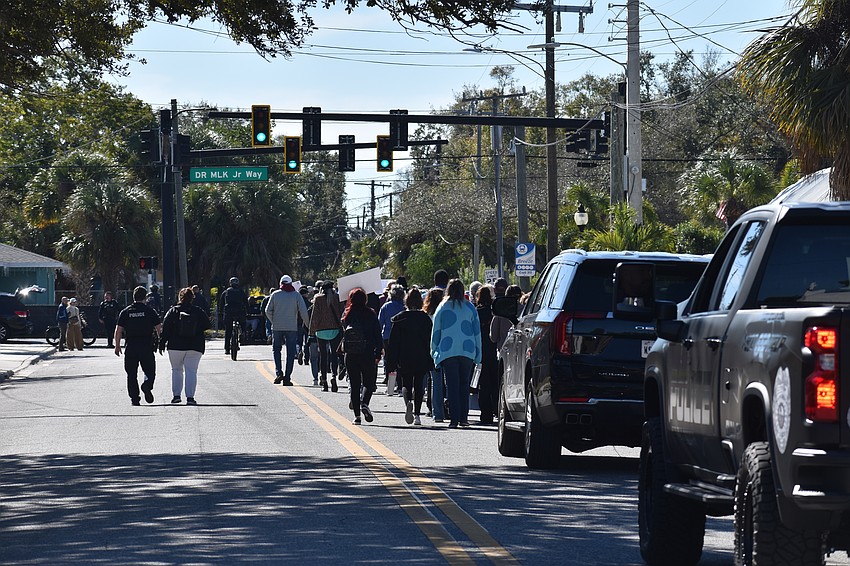 The parade approaches Martin Luther King Jr. Way.