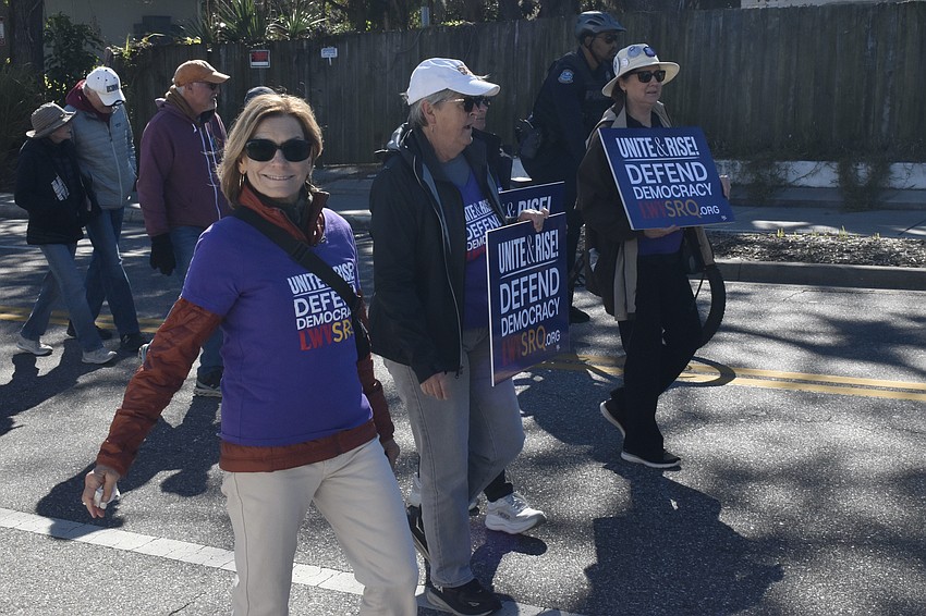 Margaret Bryan, Susie Murray and Liz Barber of the League of Women Voters walk in the parade.