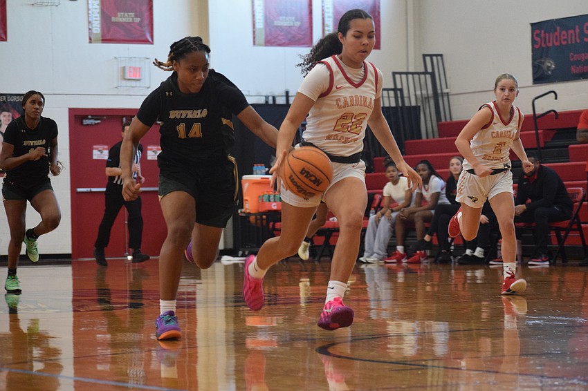 Sophomore guard Emily Wilson drives to the basket. Standing at 5-foot-8, she's the Cougars' fourth-leading scorer with 6.2 points per game, as of Jan. 19.