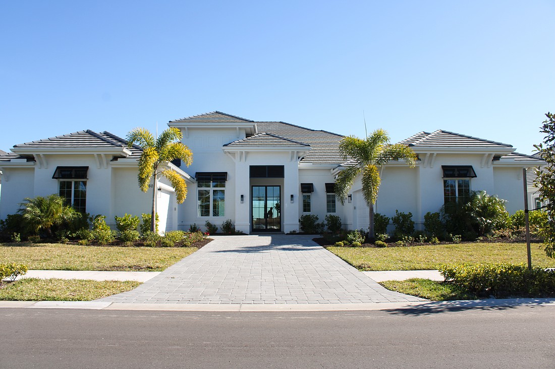 This Wild Blue at Waterside home at 560 Blue Shell Loop sold for $3.41 million. Built in 2025, it has four bedrooms, four-and-two-half baths,
a pool and 4,452 square feet of living area.