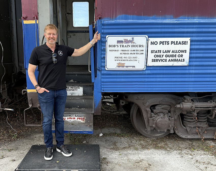 Mark Vengroff with Bob's Train, the diner that will be moved elsewhere on the Sarasota Station and renovated.