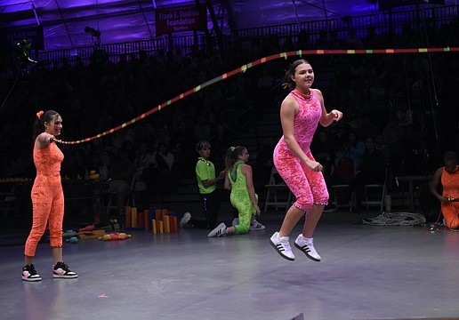 Alaina Loyal and Gia Sammelman demonstrate concepts including push, pull, kinetic energy, friction.