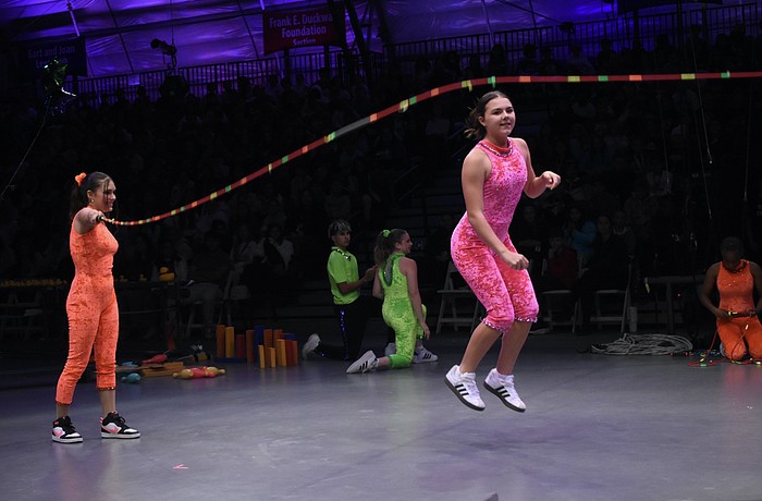 Alaina Loyal and Gia Sammelman demonstrate concepts including push, pull, kinetic energy, friction.