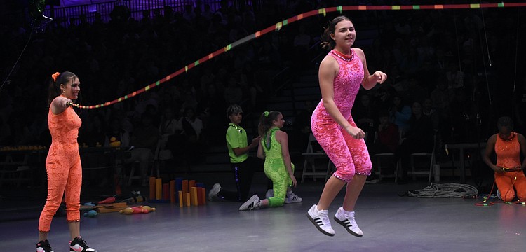 Alaina Loyal and Gia Sammelman demonstrate concepts including push, pull, kinetic energy, friction.