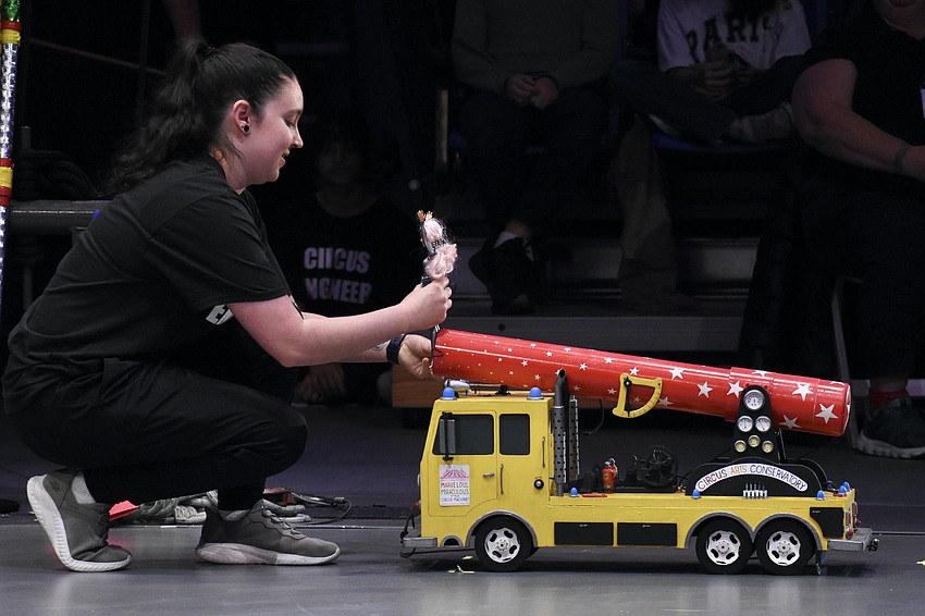Siena Hartzell introduces Barbie as the special guest for the human cannonball, for which the force must be carefully calculated to make sure she lands in the net.