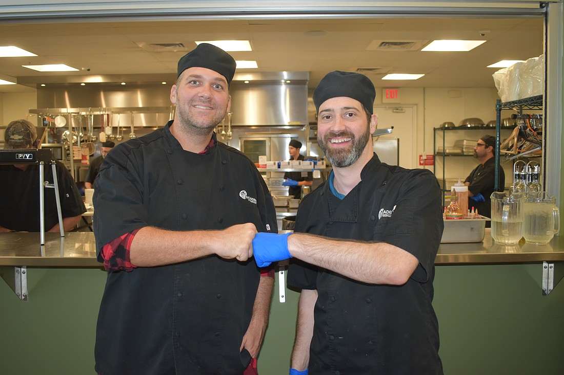 Brent Jephson and Chef Instructor Benjamin Burnside celebrate a job well done.