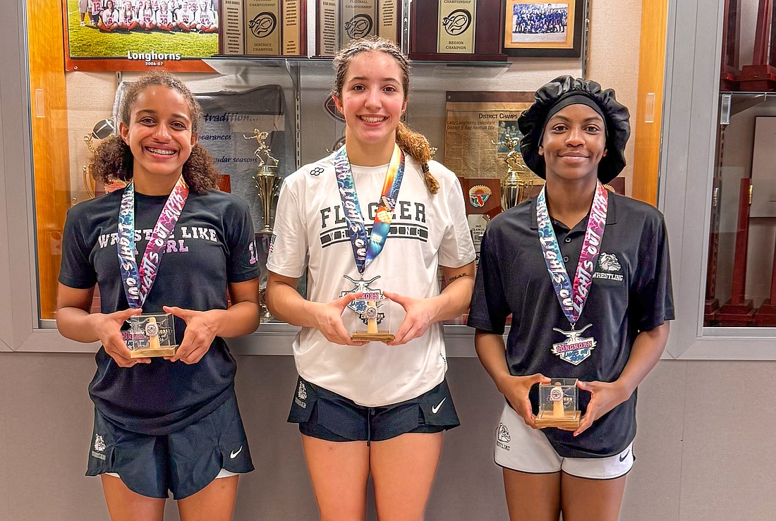 Juliana Mills, Alisha Vilar and Joslyn Johnson won championships at the Lady Longhorn Lights Out tournament. Courtesy photo by Andrea Vilar