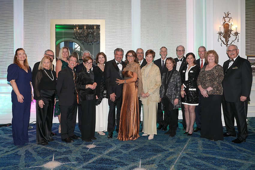 Orchestra Music Director Giancarlo Guerrero and his wife, Shirley, center, and the Sarasota Orchestra Board of Directors stop for a quick photo together.