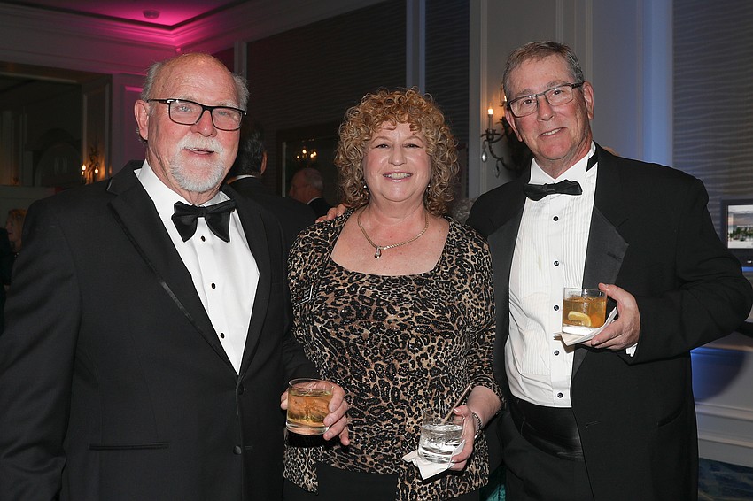 Thomas Taylor enjoys a cocktail with Deborah Breslof and her husband, Ray, who donned his favorite tux for the event.