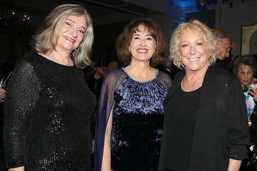 Mel O'Donnell, Gloria Koach and Sherry Koski catch up during the cocktail reception.