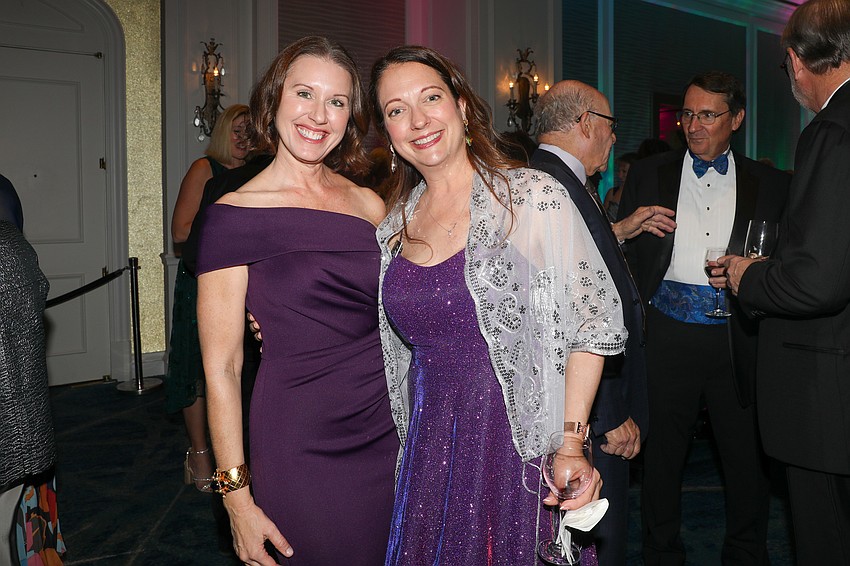 Lauren Hersh and Hollie Mowry are pretty in shades of purple.