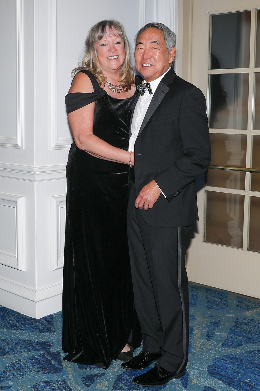 Brenda and Wesley Moy are dashing in their finest attire for an evening of orchestra support.